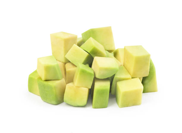 diced avocado on a white background